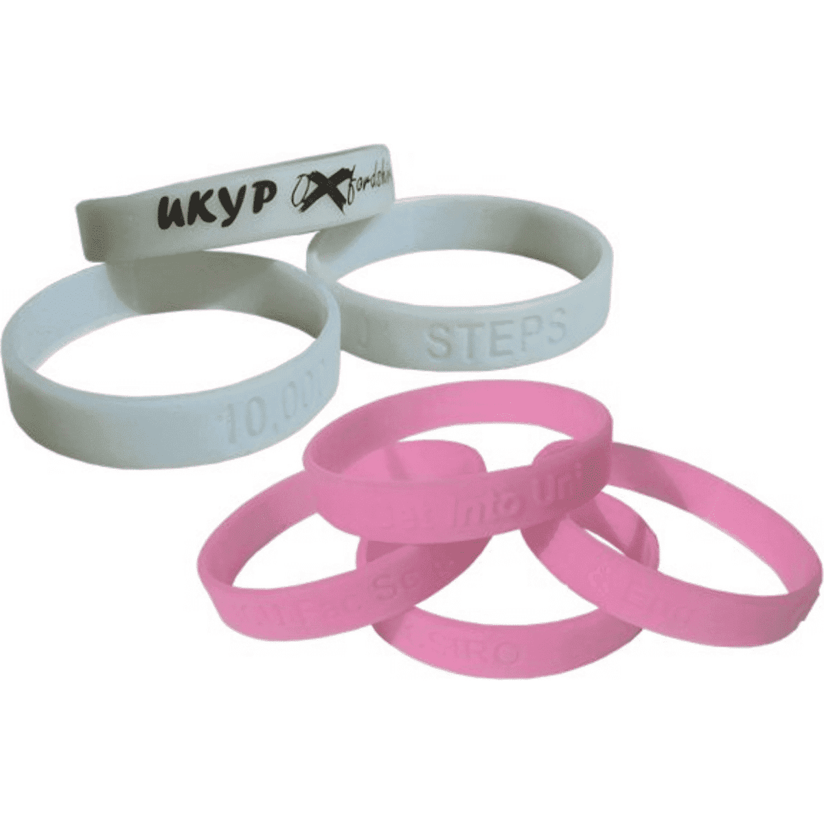 Silicone wristbands in pink and white, some debossed with text, featuring a logo on one band.