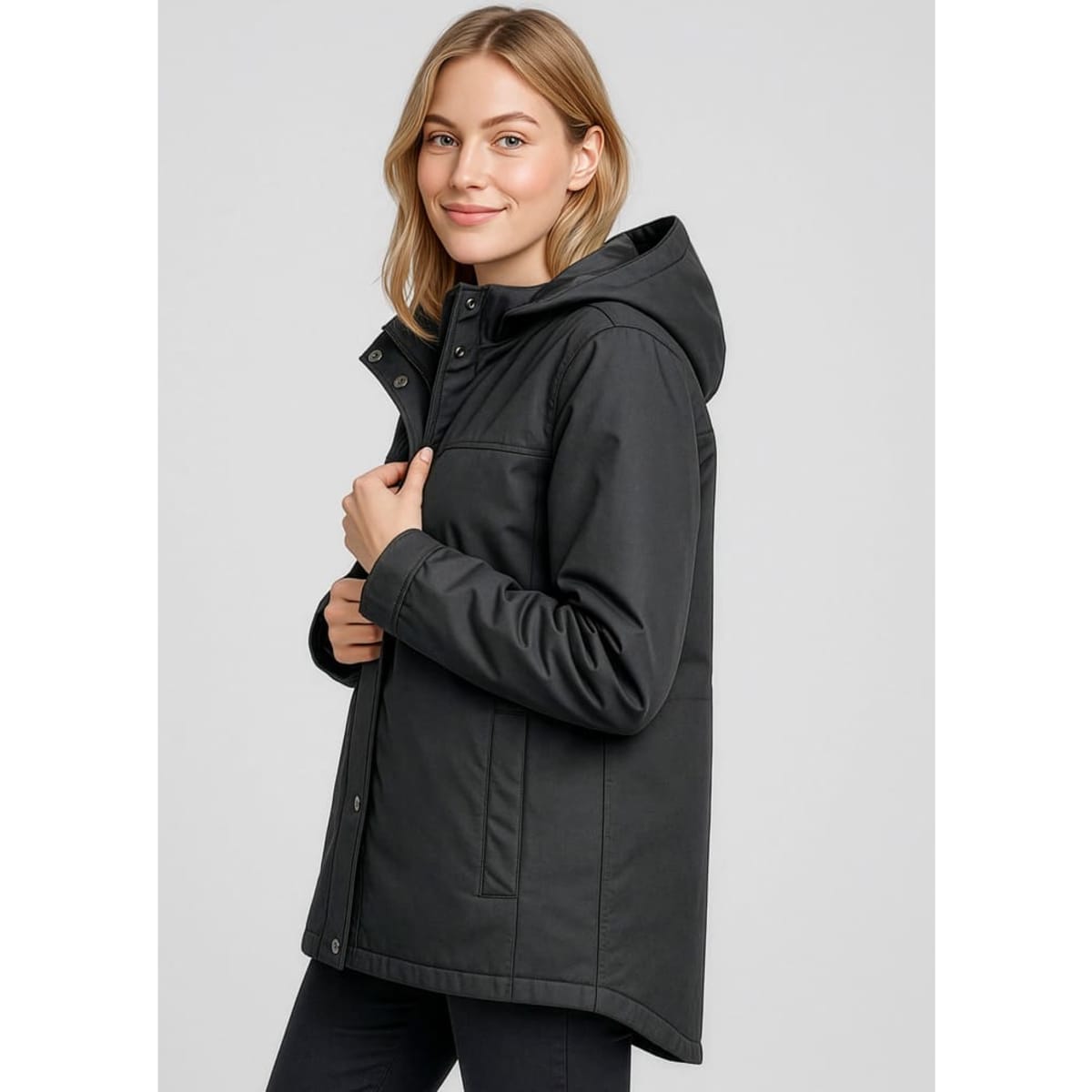 A women's black Melbourne Comfort Jacket with a hood, featuring a zip closure and side pockets. The jacket has a logo.