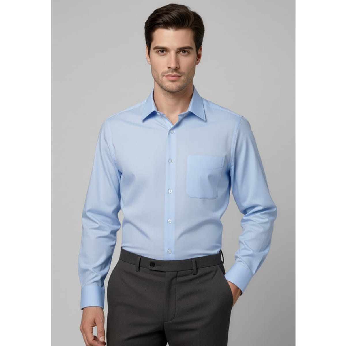A blue long sleeve button-up shirt with a chest pocket, featuring a logo on the fabric.