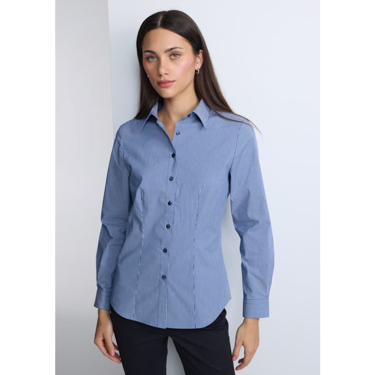 A blue and white striped long sleeve shirt with a button-down front, featuring a logo.