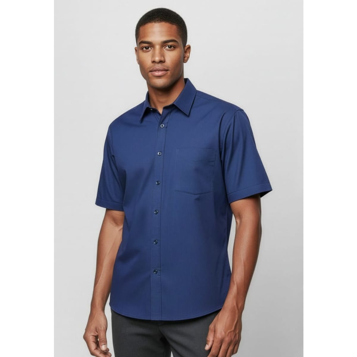 A navy short sleeve button-up shirt with a collar and single chest pocket, featuring a subtle micro check pattern.