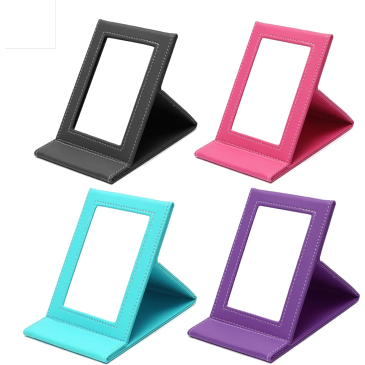 A collection of four leather-coated makeup mirrors in black, pink, teal, and purple, each with a stand and surrounding frame.