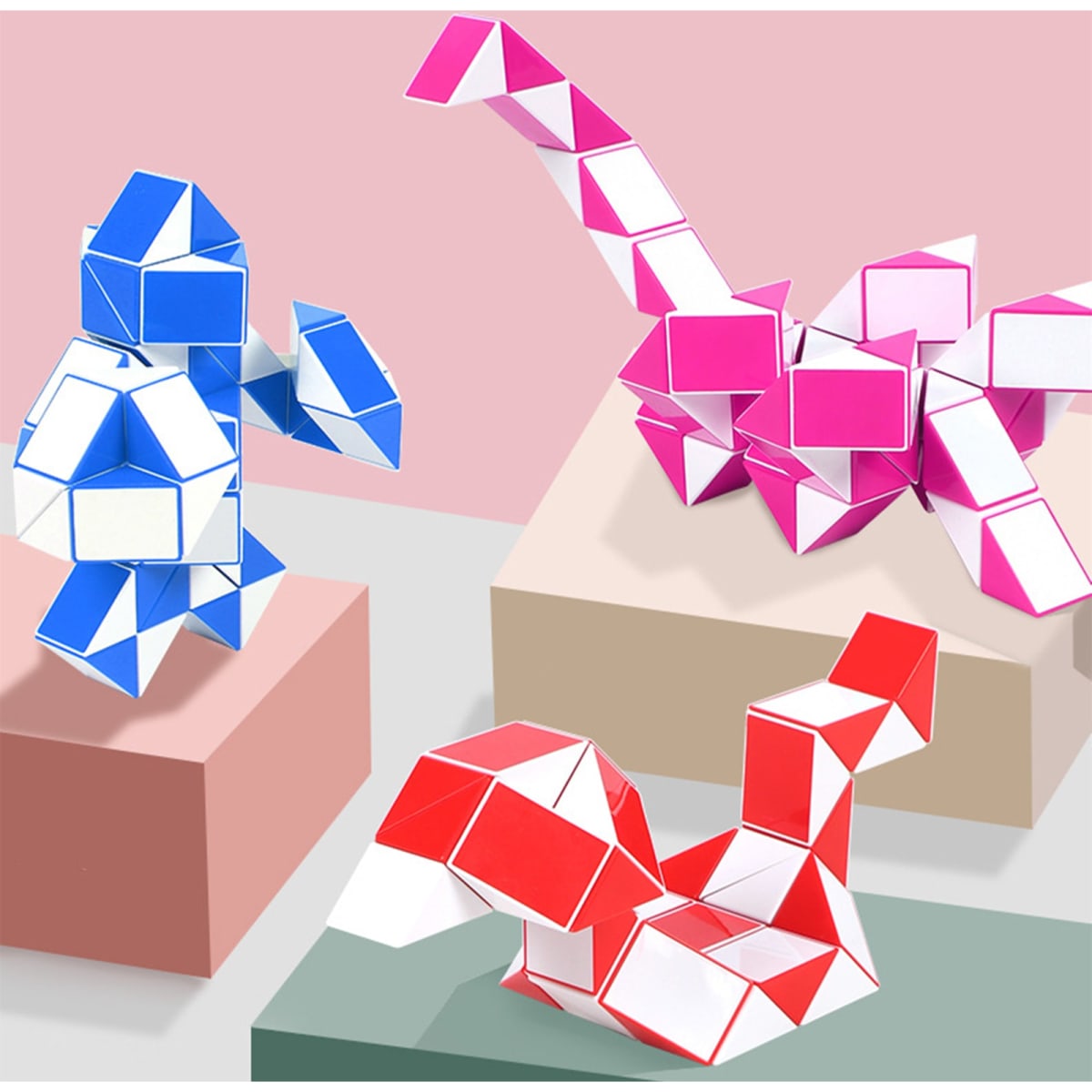 Three colourful 24 Segments Magic Rulers in blue, pink, and red, forming various shapes on pastel backgrounds.