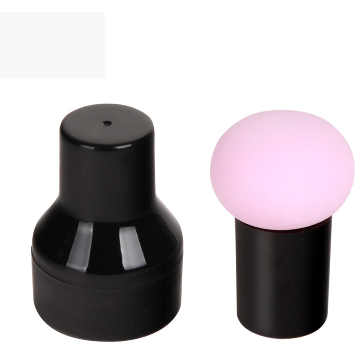A black product container alongside a pink mushroom-shaped puff, promoting beauty and personal care use.