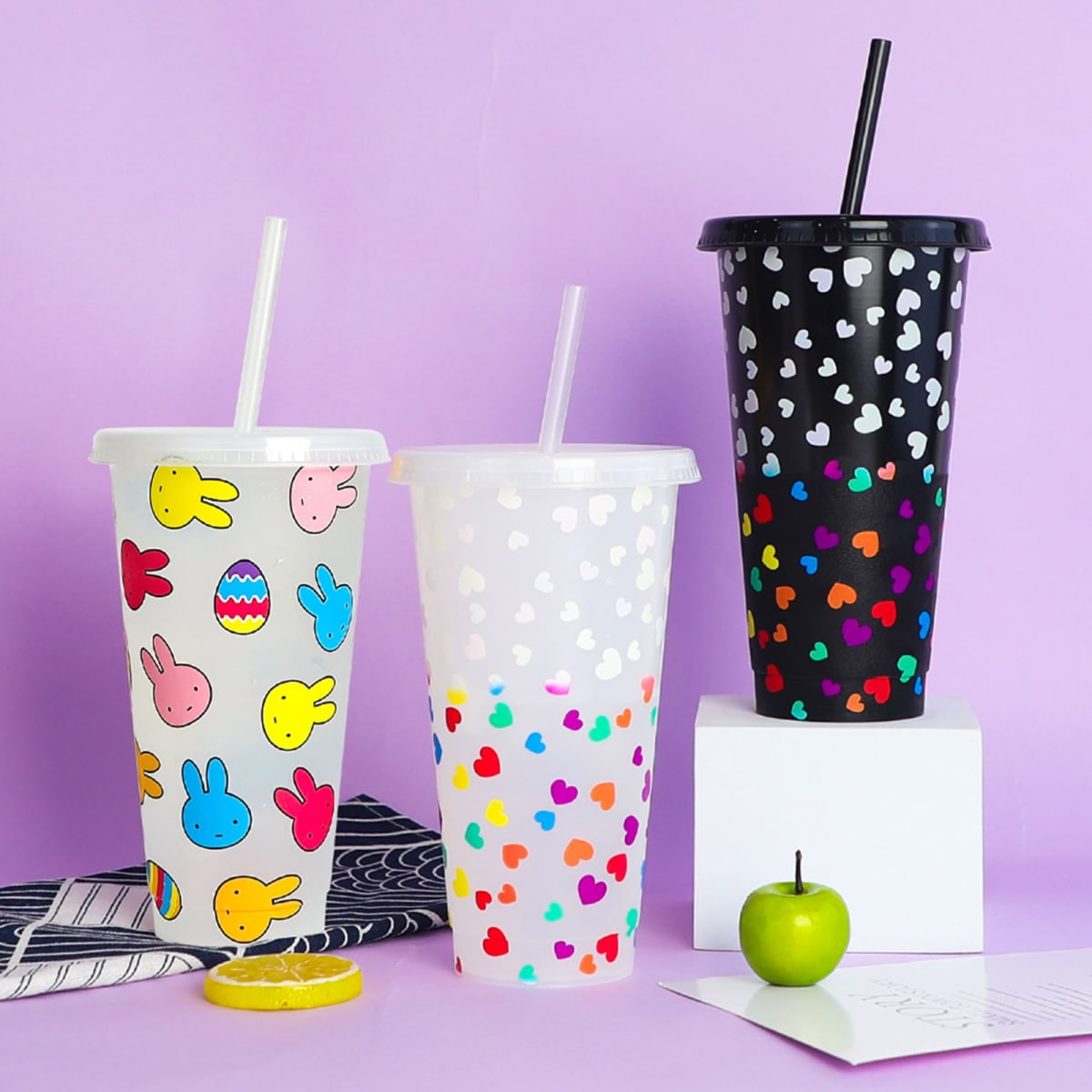 A drink bottle set featuring three 24oz colour changing cups with straw, decorated in playful bunny and heart patterns.