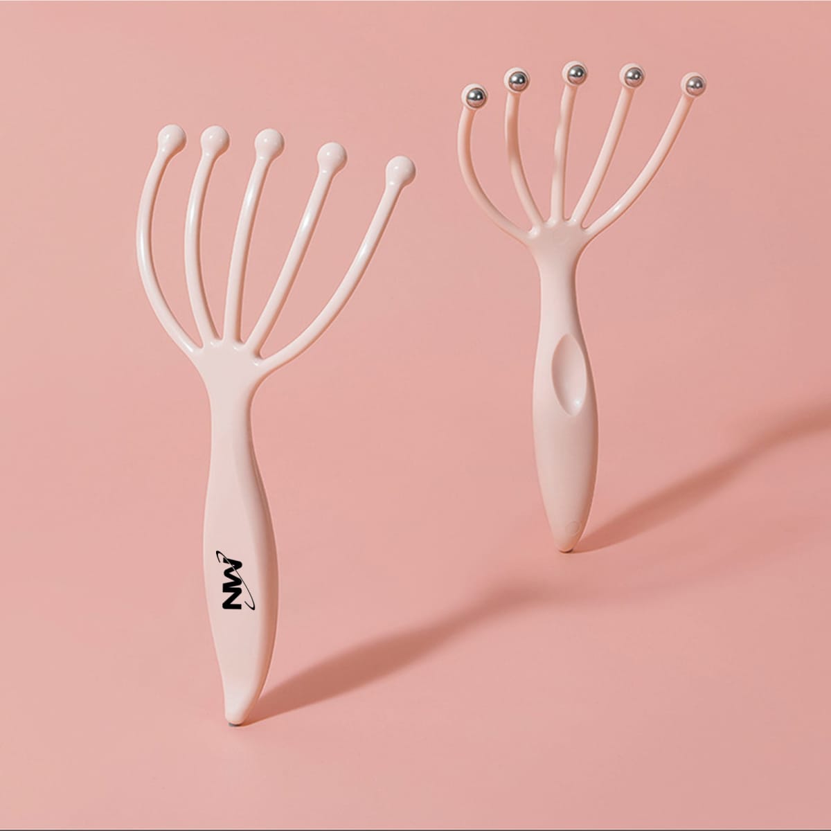 A pink head massager with multiple prongs and ball tips. The product features a logo on its handle.