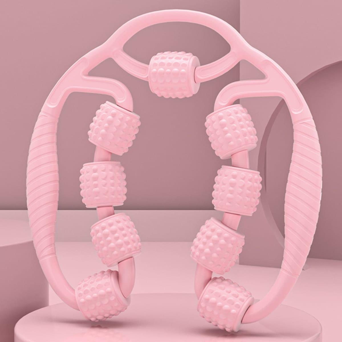 A pink leg massager with textured rollers, designed for muscle relaxation and relief. It features a contoured handle.