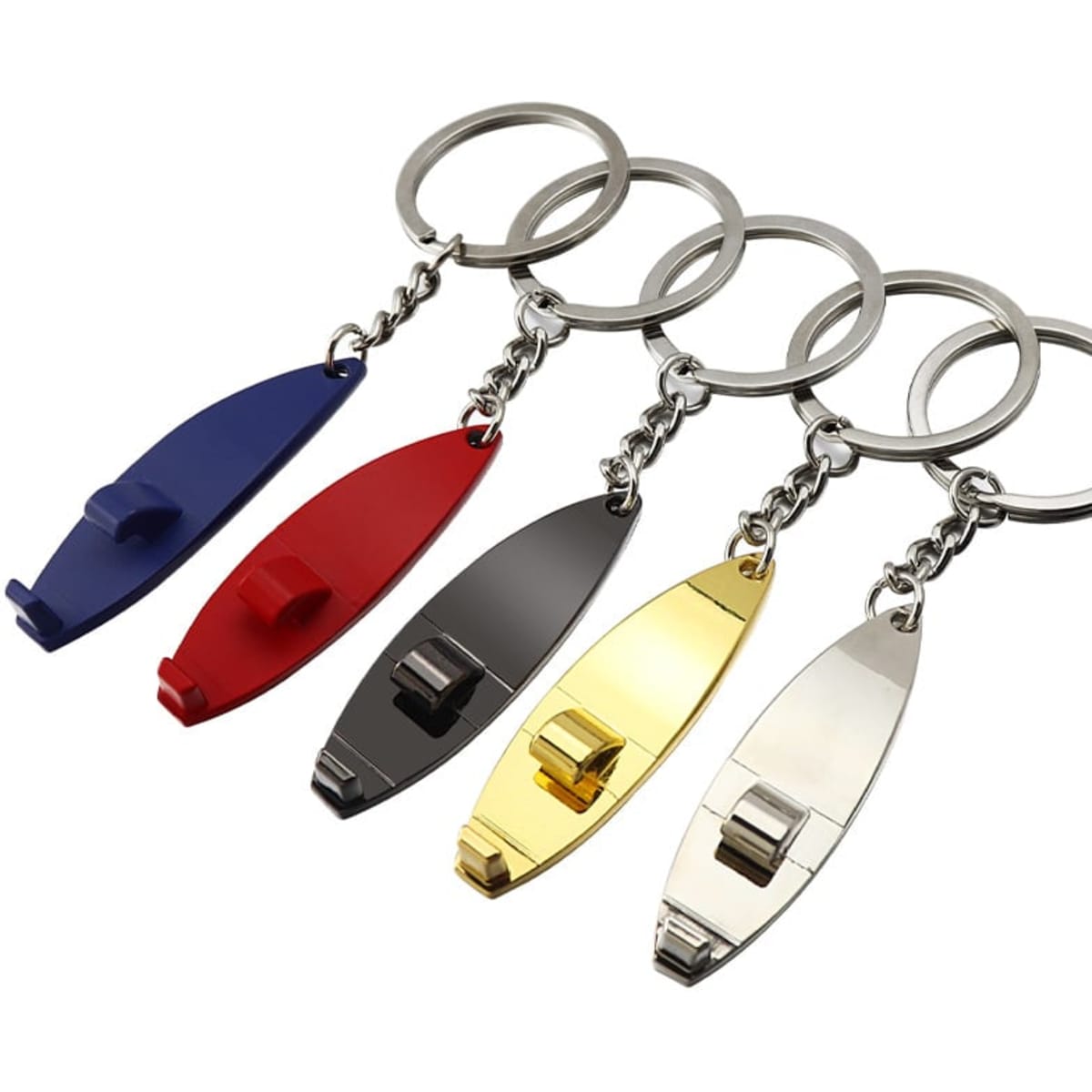 A surfboard-shaped keychain set featuring red, blue, silver, gold, and black finishes, with metal keyring attachments.