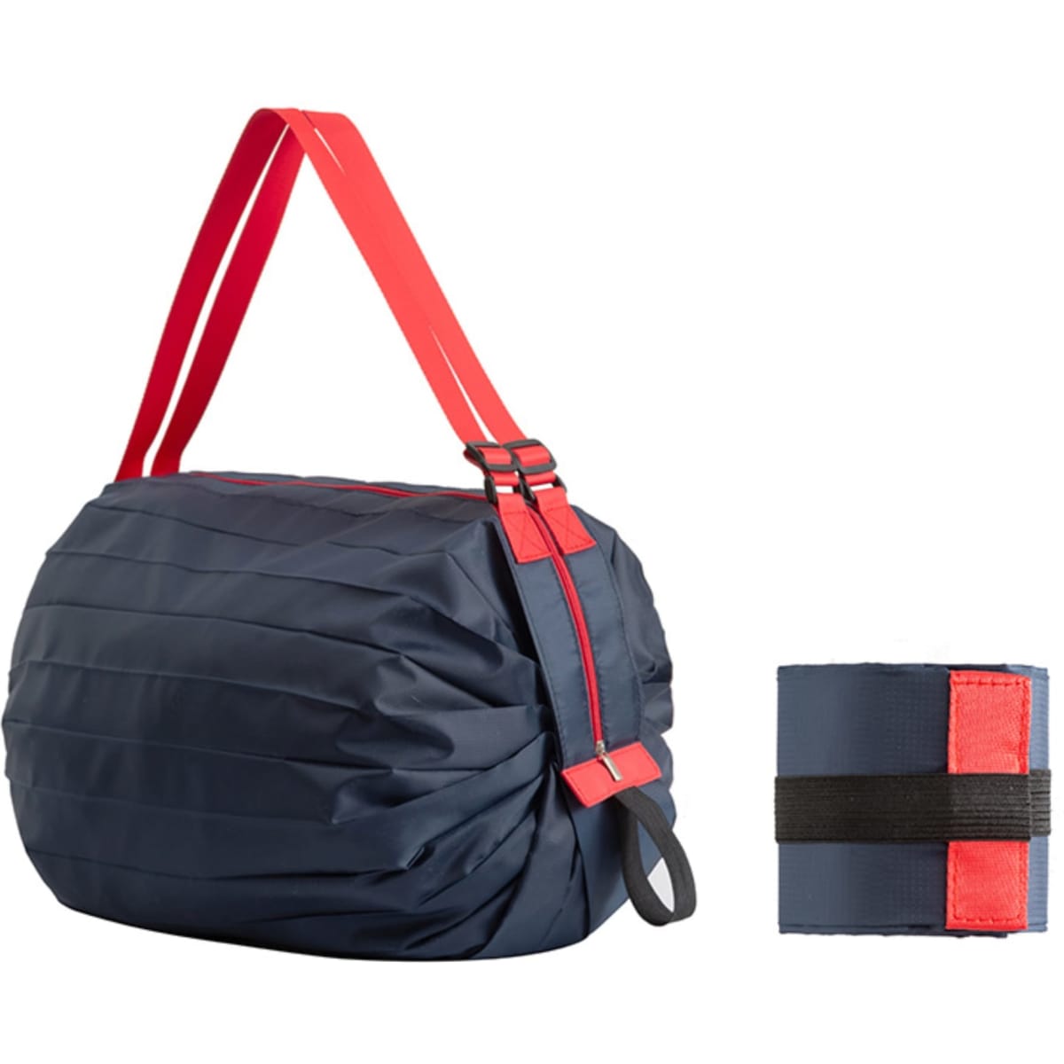 A foldable shopping bag in navy blue with bright red straps, displayed alongside its compact folded form.