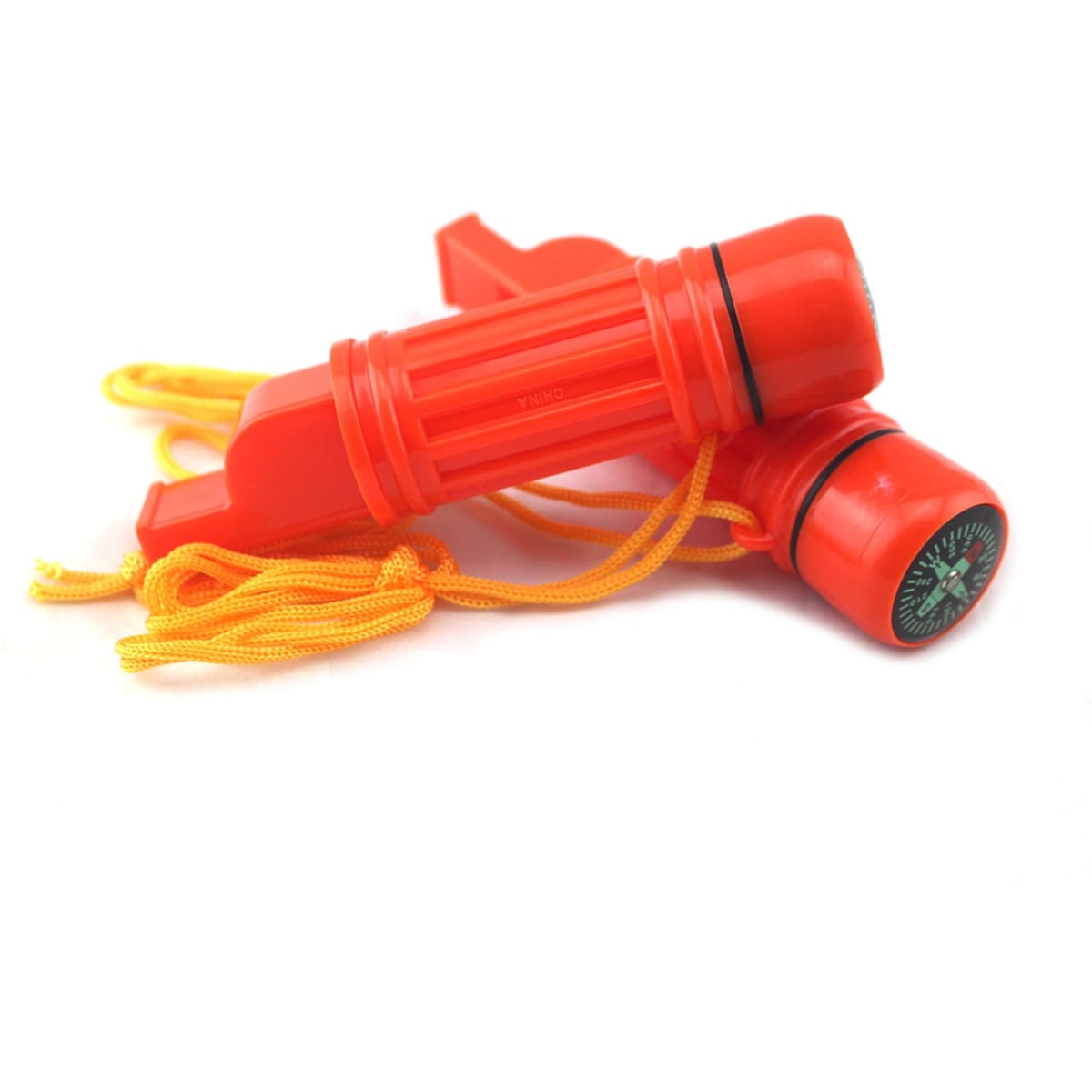 A survival tube set in bright orange, featuring a whistle and a compass, both attached with yellow cords.