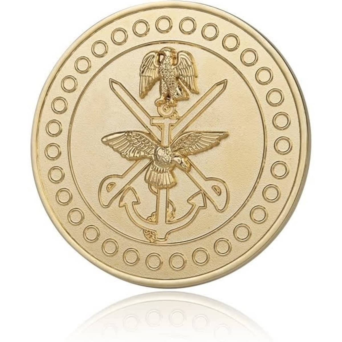 A gold custom-shaped challenge coin with detailed engravings of an eagle and crossed swords, featuring a circular border of dots.