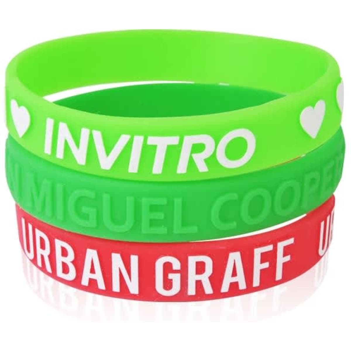 Three silicone wristbands in green, red, and a mix of both, featuring embossed text and branding.