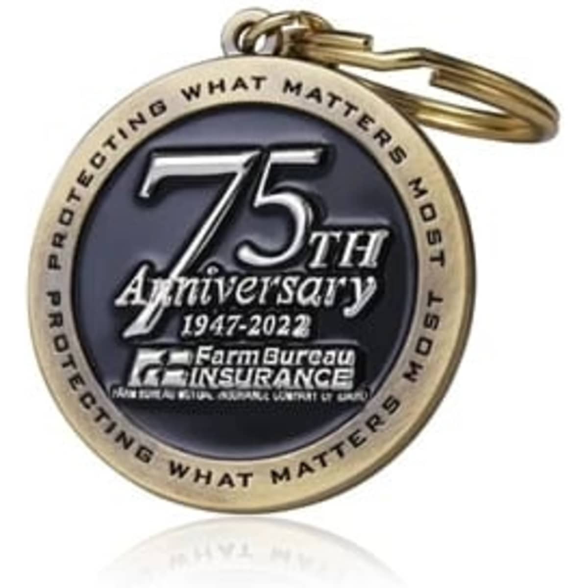 A gold and black 2.25" soft enamel keychain featuring a prominent anniversary design and a keyring attachment.