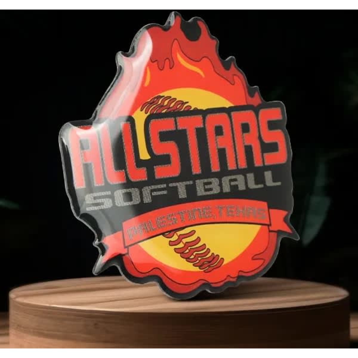 A vibrant flame-shaped promotional pin featuring a softball and the "All Stars Softball" logo in red and yellow.