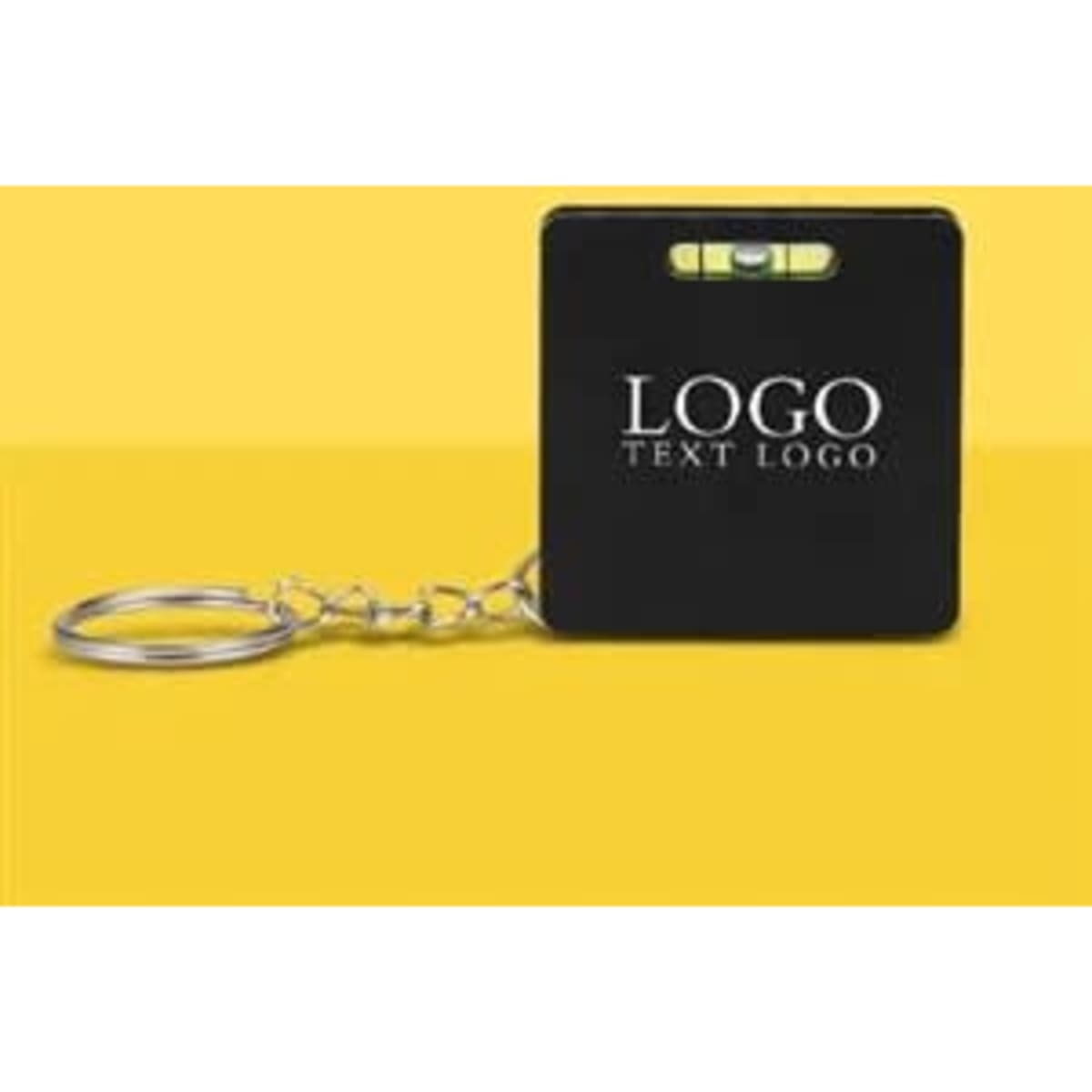 A black square level tape measure key tag with a metallic keyring and a level vial on top.