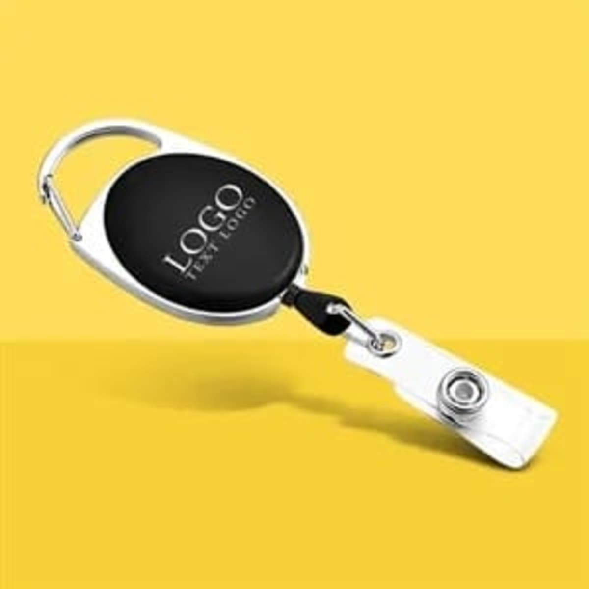 A custom plastic badge holder with a retractable mechanism, featuring a black body and silver clip.