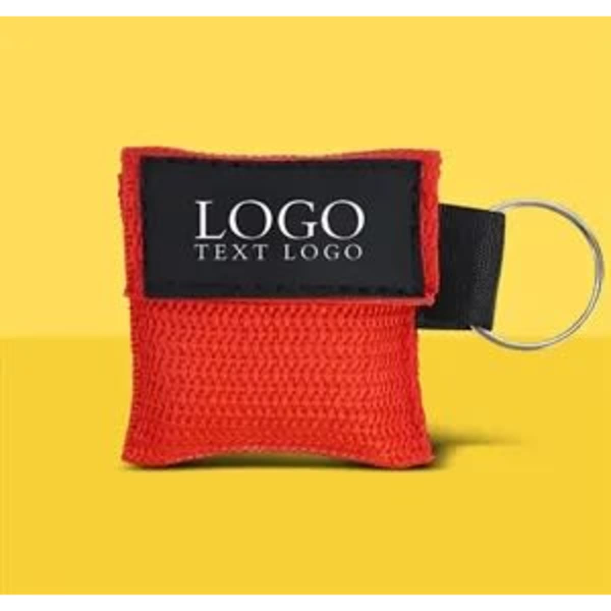 A red custom CPR face shield mask keyring with a black fabric patch and ring attachment.