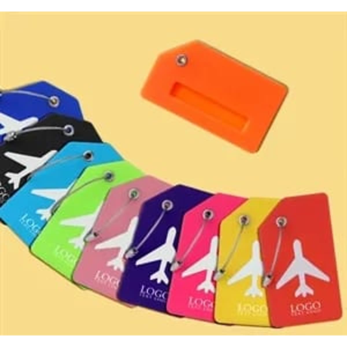 A collection of silicone airline luggage tags in various colours including orange, blue, green, pink, and purple, featuring a logo.