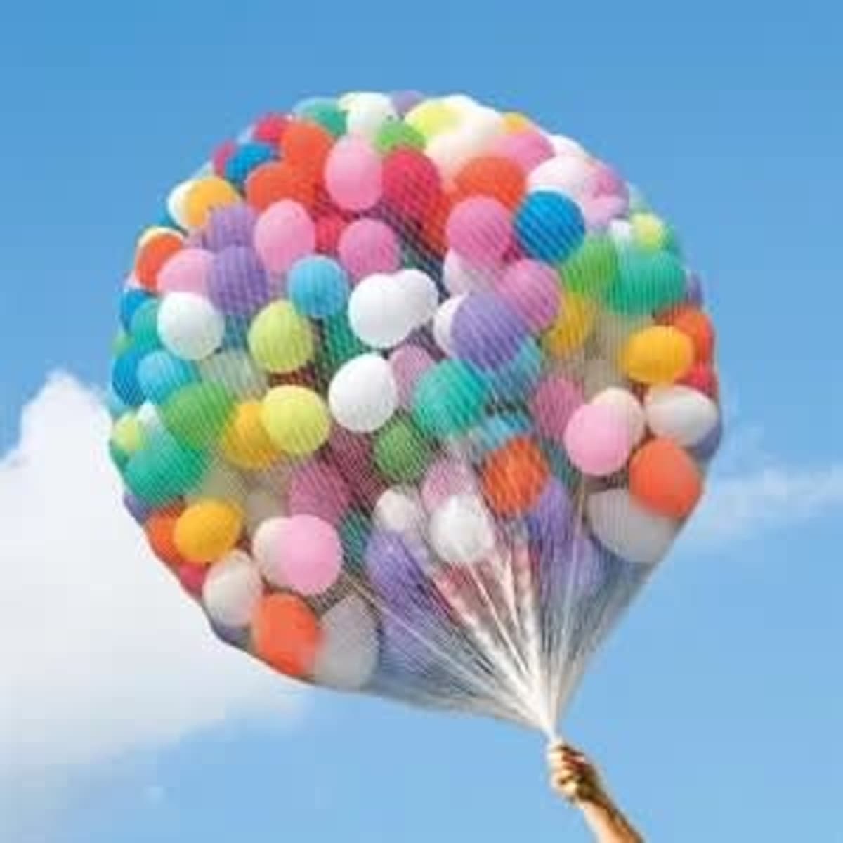 A vibrant balloon drop set featuring an assortment of colourful balloons in various shades, held in a net.