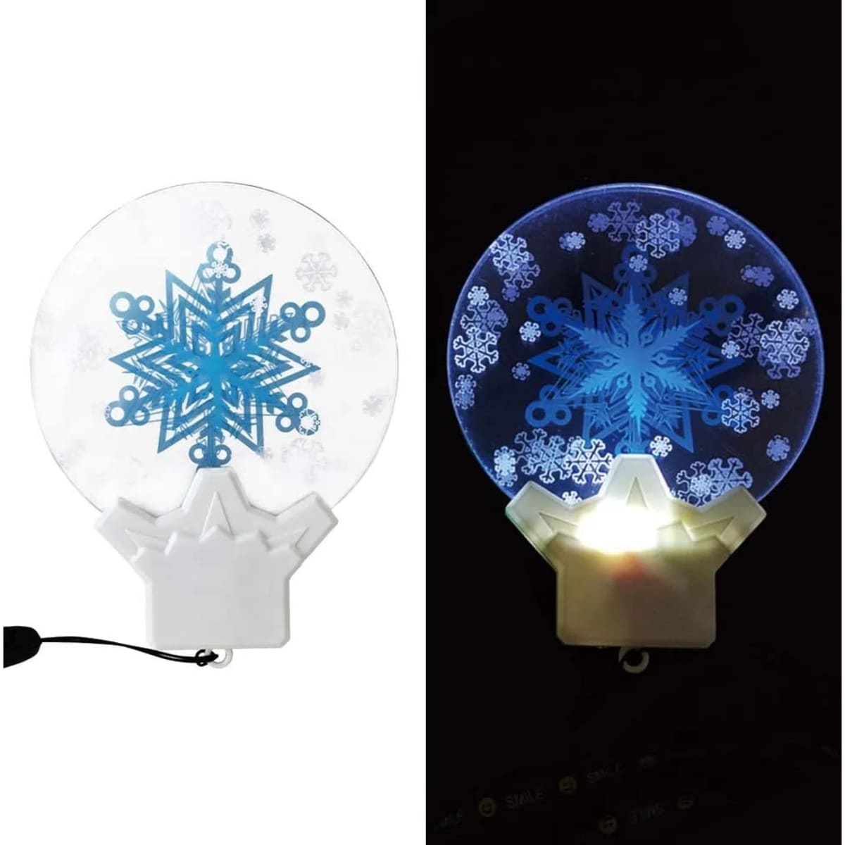 A circular, transparent acrylic ornament featuring a blue snowflake design, illuminated with LED light.