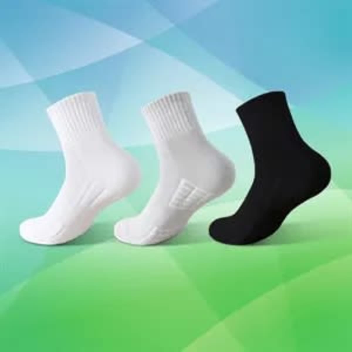 Quarter cushioned sports socks in white and black, featuring a non-slip design and a logo on the side.