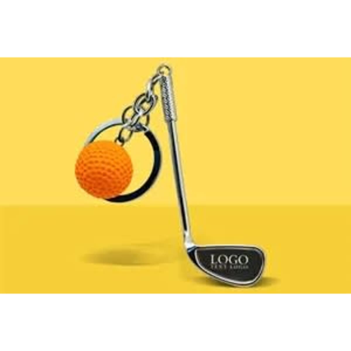A silver golf club keychain with an orange golf ball attached, featuring a logo.