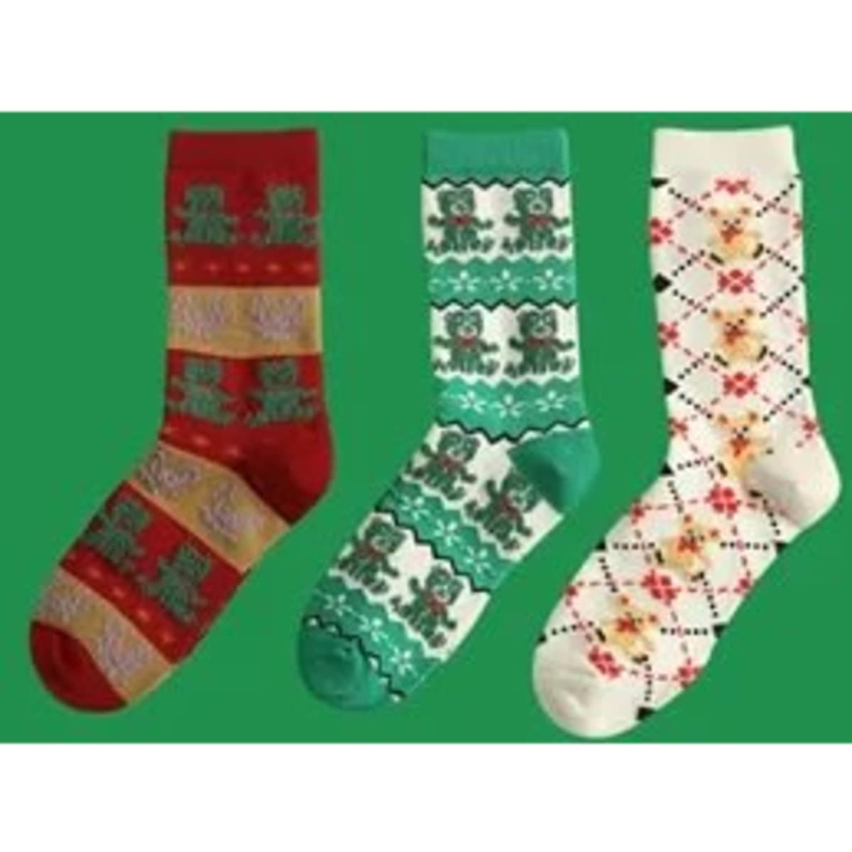 Three pairs of custom Christmas cotton crew socks in red, green, and cream with festive patterns.