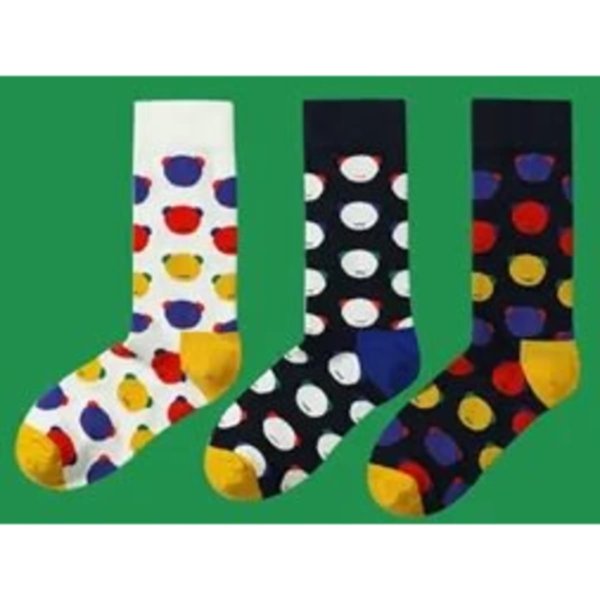 Three pairs of dress socks featuring bear head patterns, in white with multi-coloured bears, and navy with polka dots.