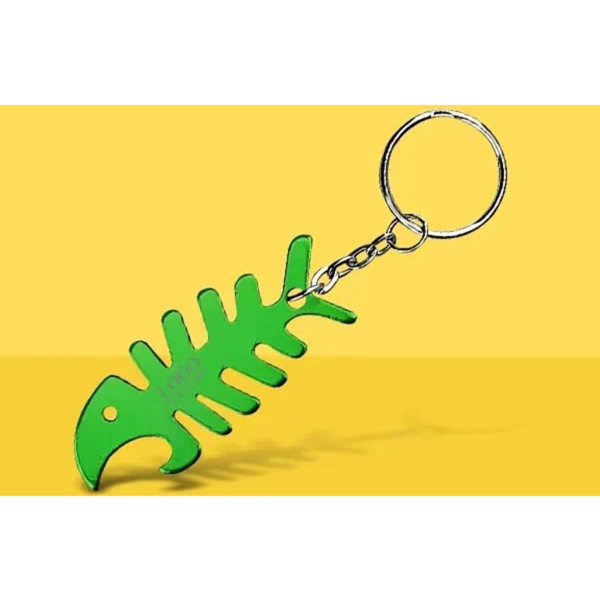 A green fish bone-shaped bottle opener keychain with a metal ring.