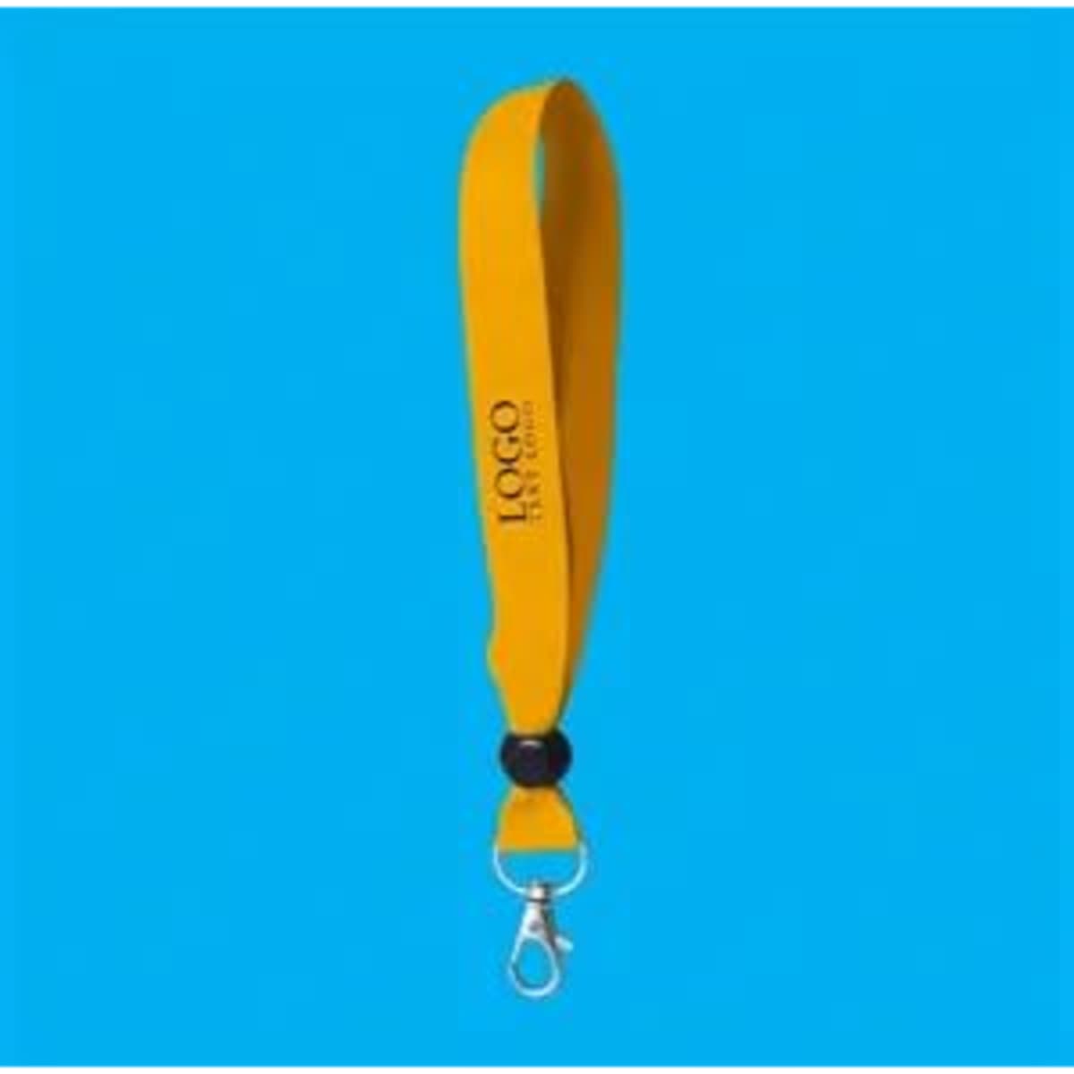 A yellow silkscreen wristband with a lobster clasp and a logo. The background is a solid blue.