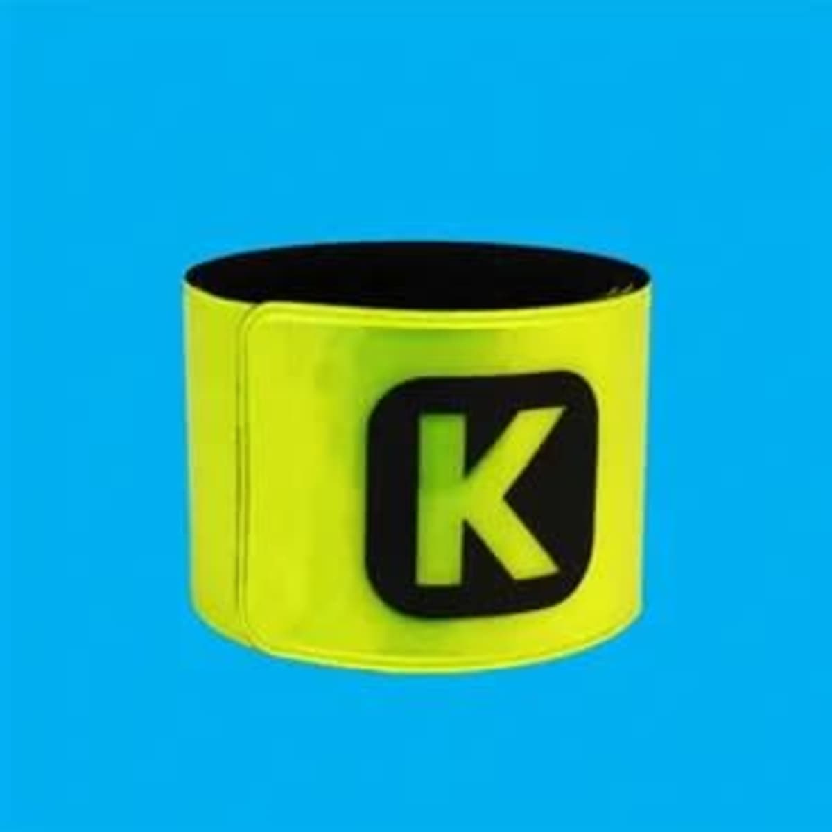 A reflective slap bracelet in fluorescent yellow with a black logo on a bright blue background.