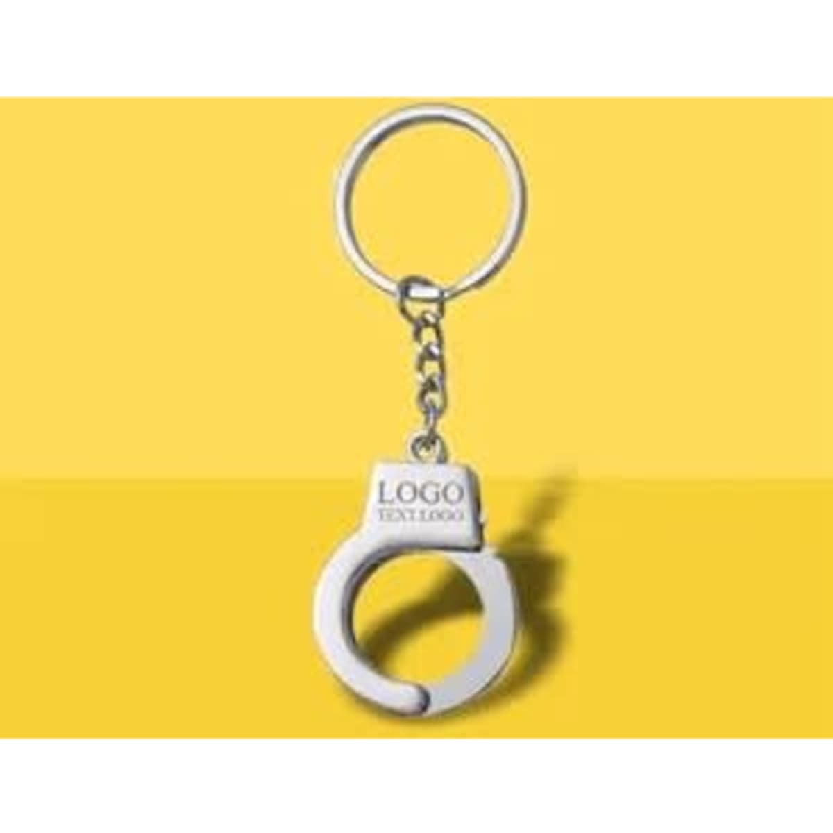 A metal key chain shaped like handcuffs, featuring a round keyring and a logo on the cuff.