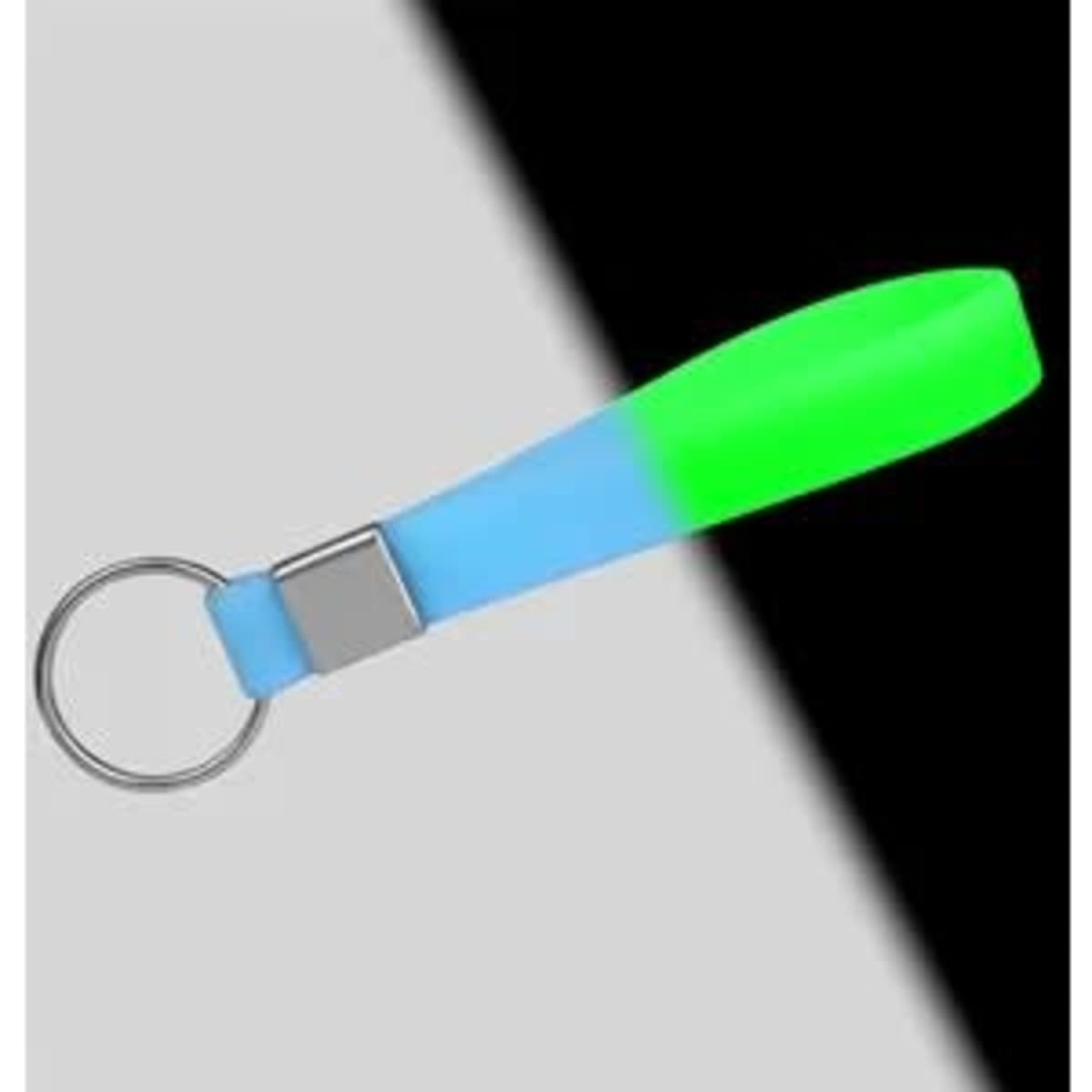 A glow-in-the-dark silicone wristband keychain in blue and green, featuring a metal keyring and a simple design.