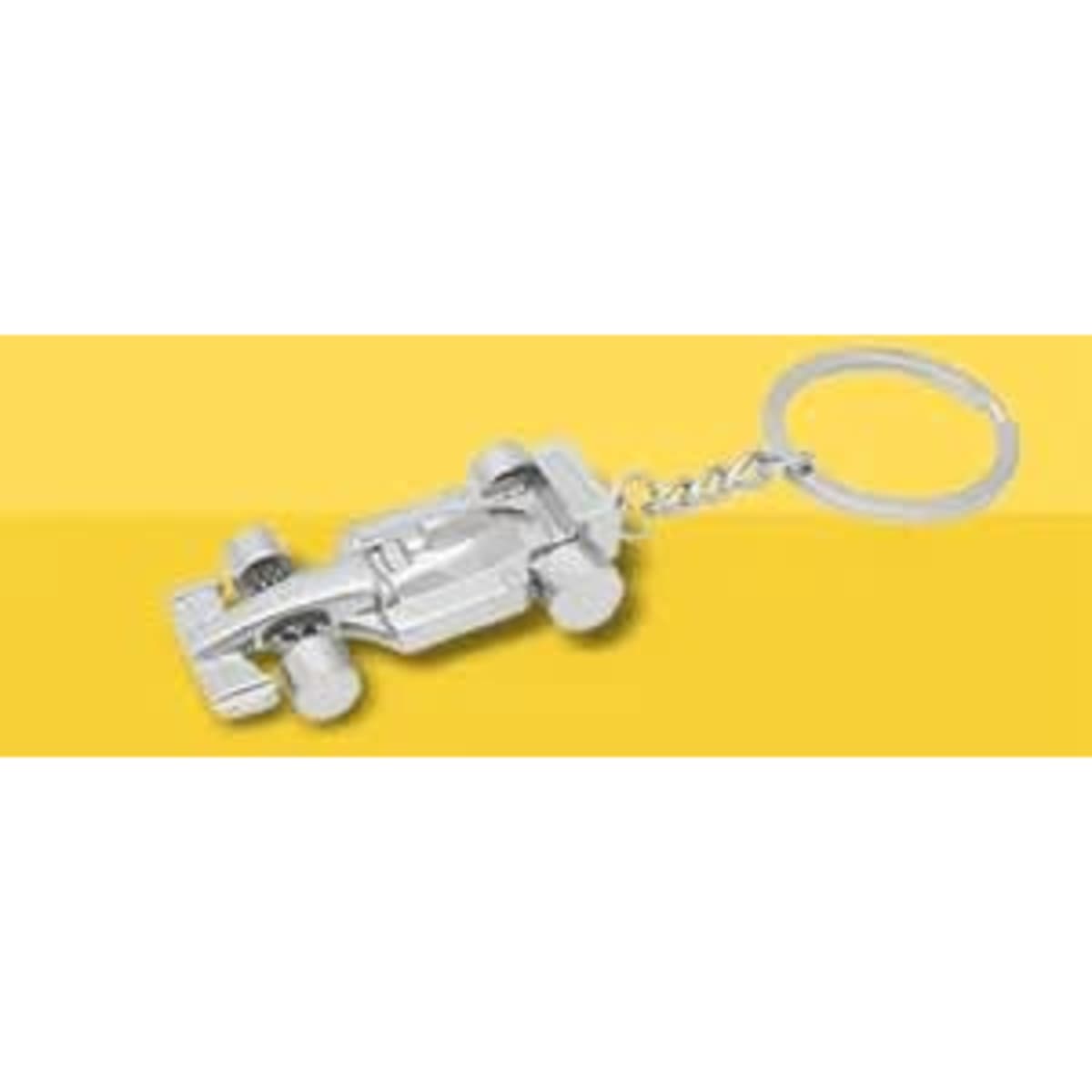 A metal keychain shaped like a silver mini race car with a circular keyring attachment.