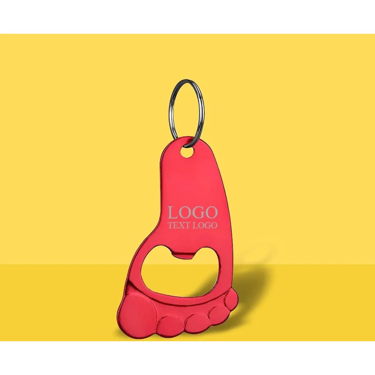 A drink bottle opener keychain in red, shaped like a foot, featuring a logo.