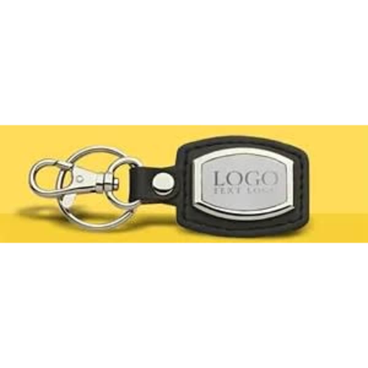 A leather and brushed plate keyring keychain in black and silver, featuring a logo.