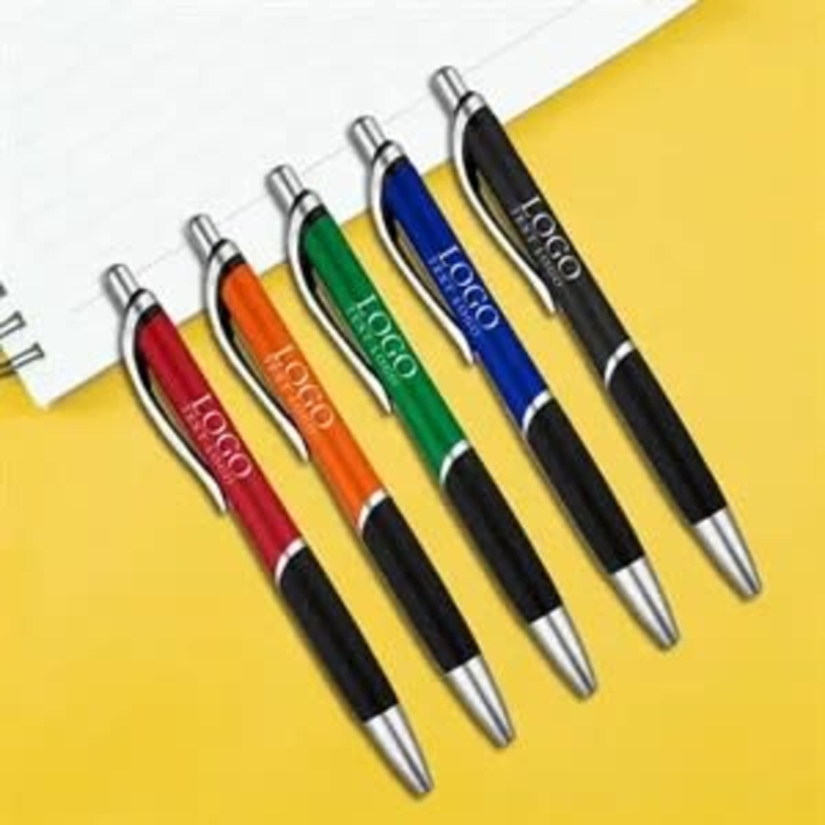 A selection of translucent ballpoint pens in red, orange, green, blue, and black with a logo.