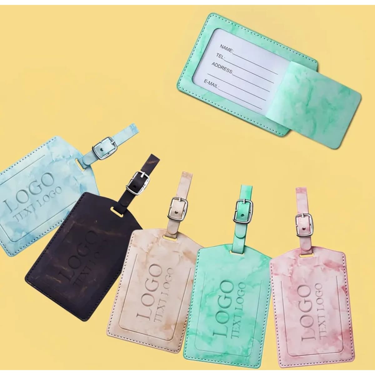 Marble luggage tags in green, blue, brown, and beige, featuring adjustable straps and a logo on each tag.