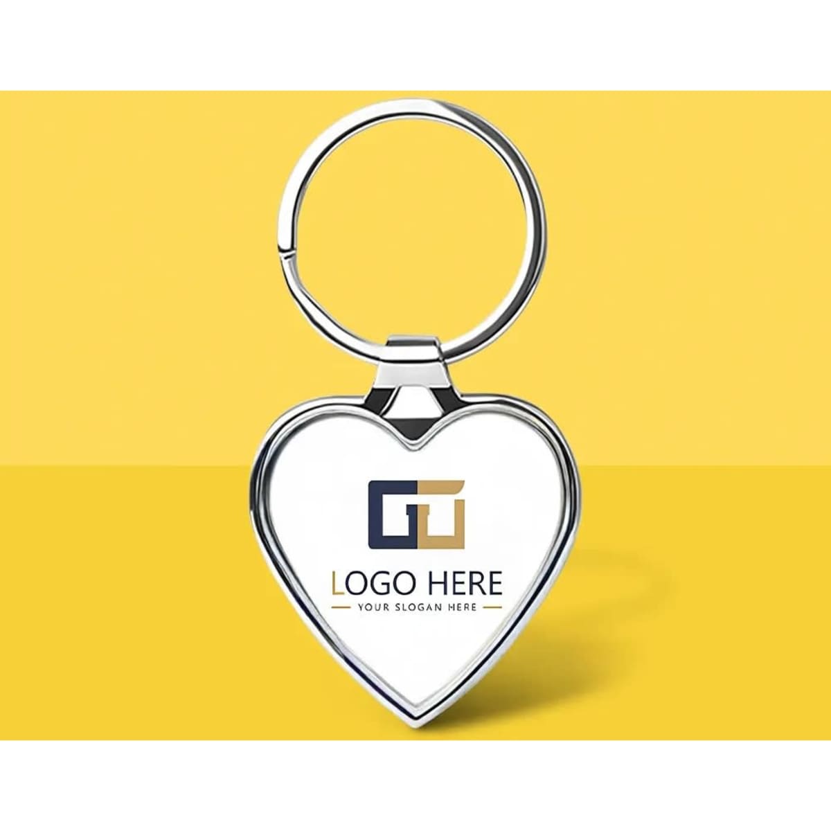 A heart-shaped stainless steel keychain with a silver finish and a logo design.