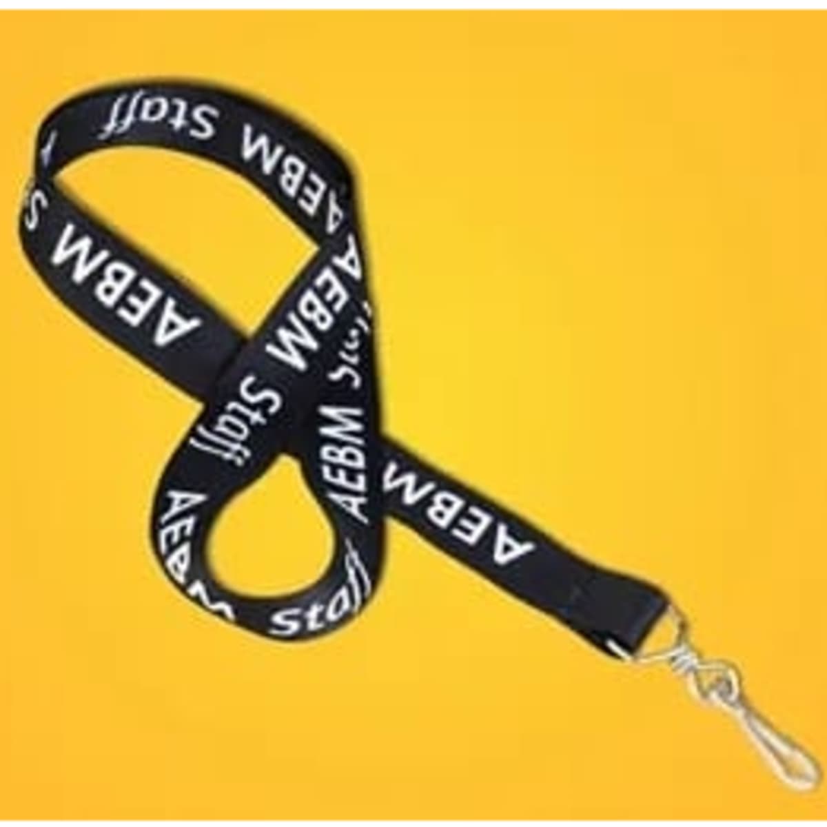 A black lanyard with white text and a silver clip, displayed against a bright yellow background.