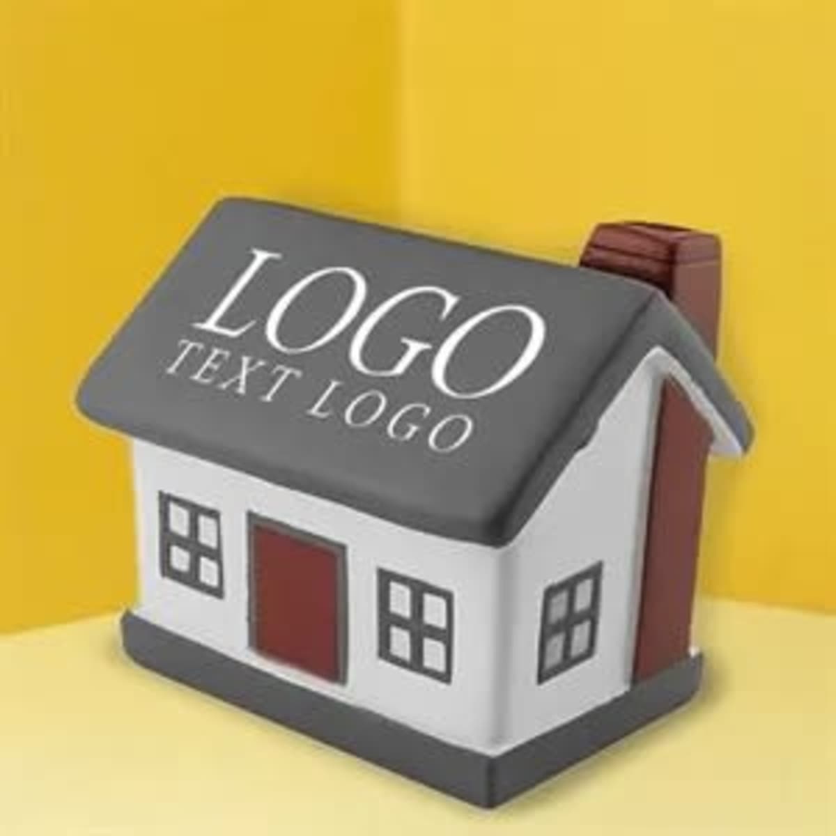 A house-shaped stress ball in white and grey, featuring a red door and a chimney, with a logo on the front.
