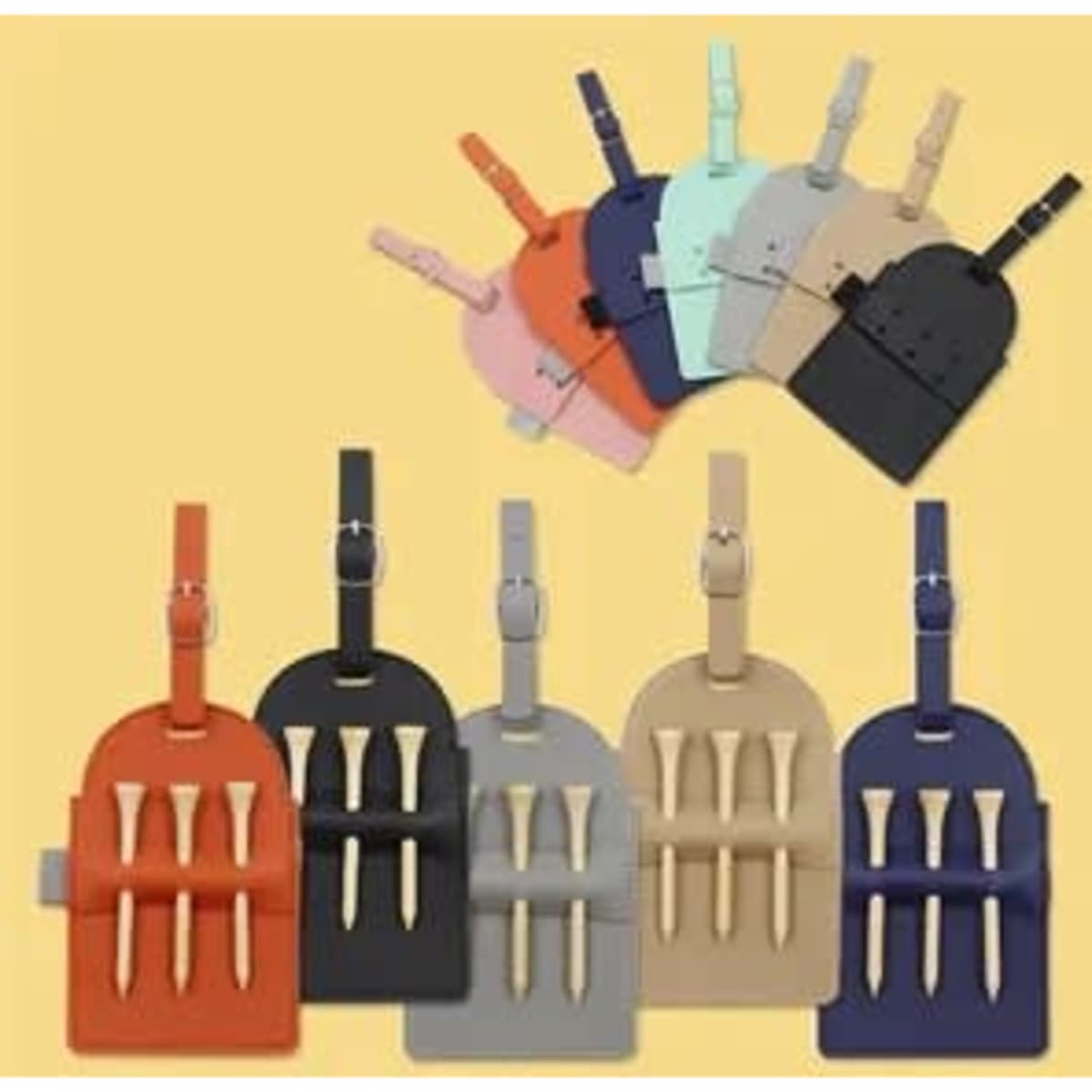 A collection of portable vegan leather golf tee bag holders in various colours, featuring a strap and slots for tees.