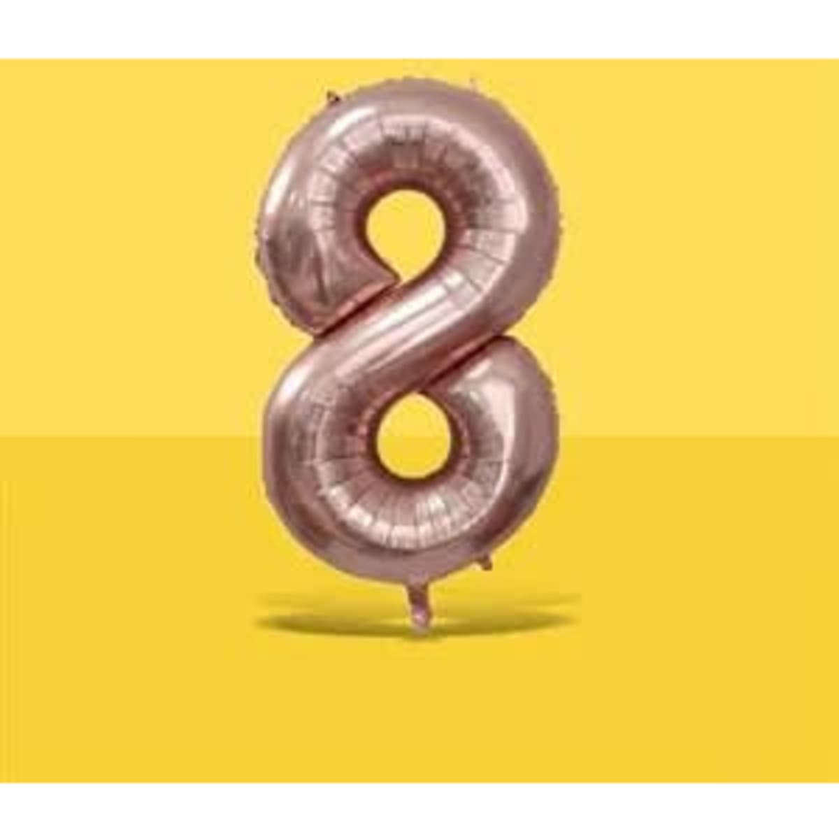 A rose gold number 8 balloon against a yellow background, featuring a shiny, reflective surface.