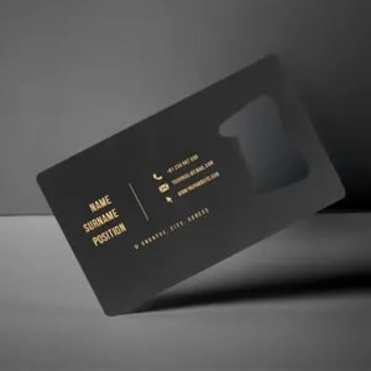 A drink bottle opener business card in black with a sleek design and gold text. It features a cut-out opener shape.