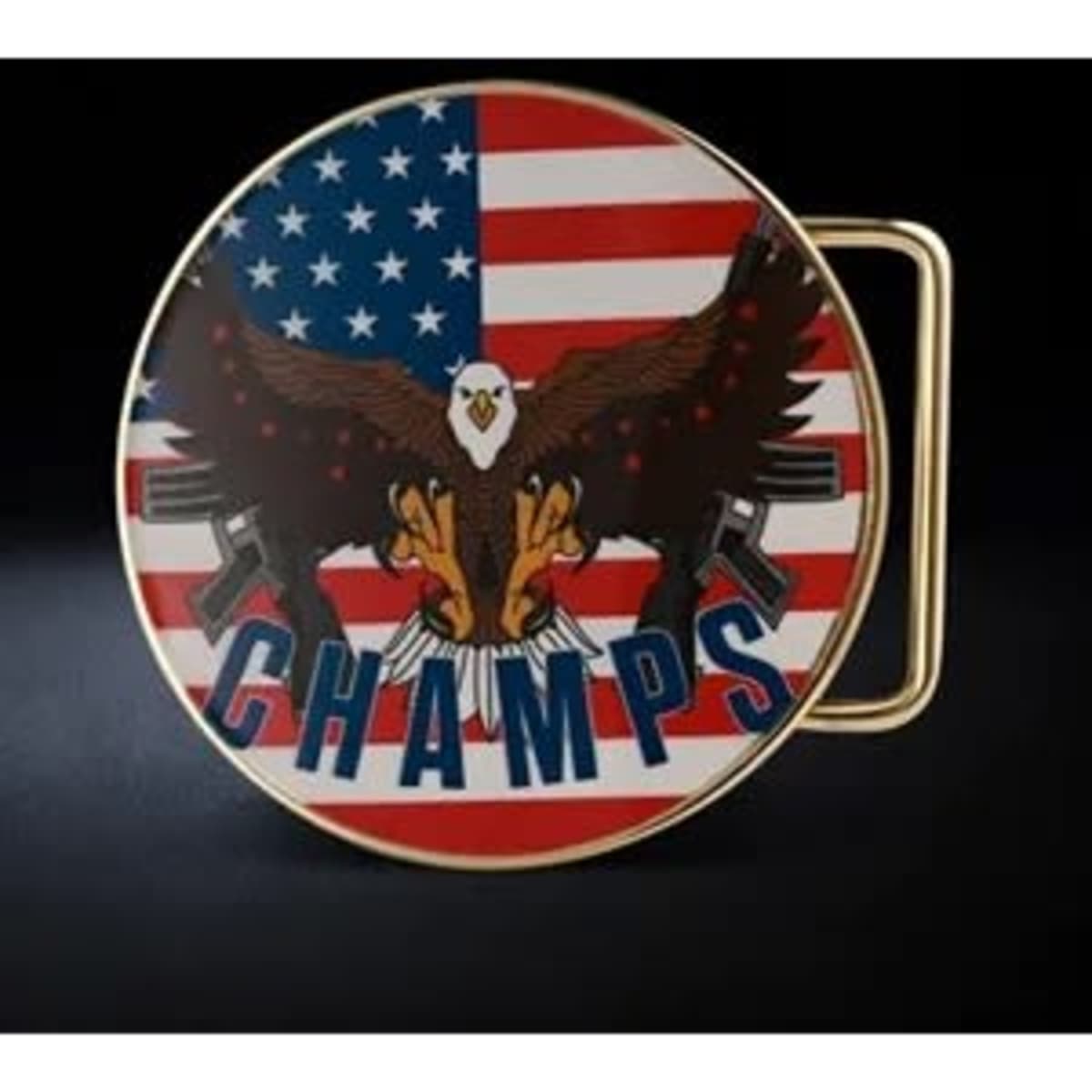 A circular belt buckle featuring an eagle design on an American flag background, with a gold metal finish.