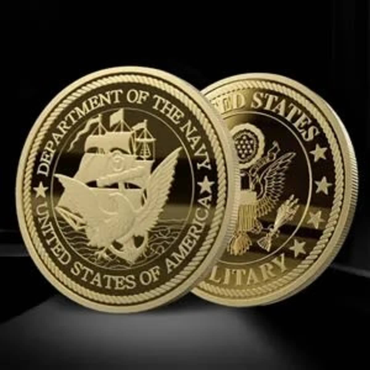 Two gold-coloured mint coins featuring embossed designs, including an eagle and nautical symbols, with branding elements.
