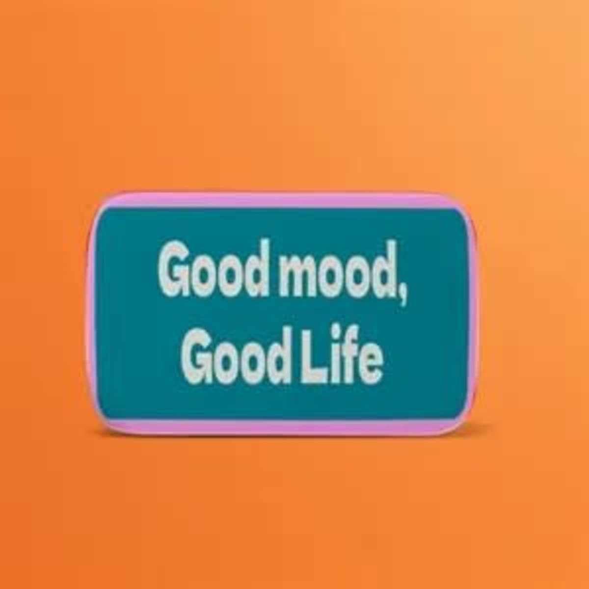 A rectangular custom button in teal and pink with a logo displayed on an orange background.