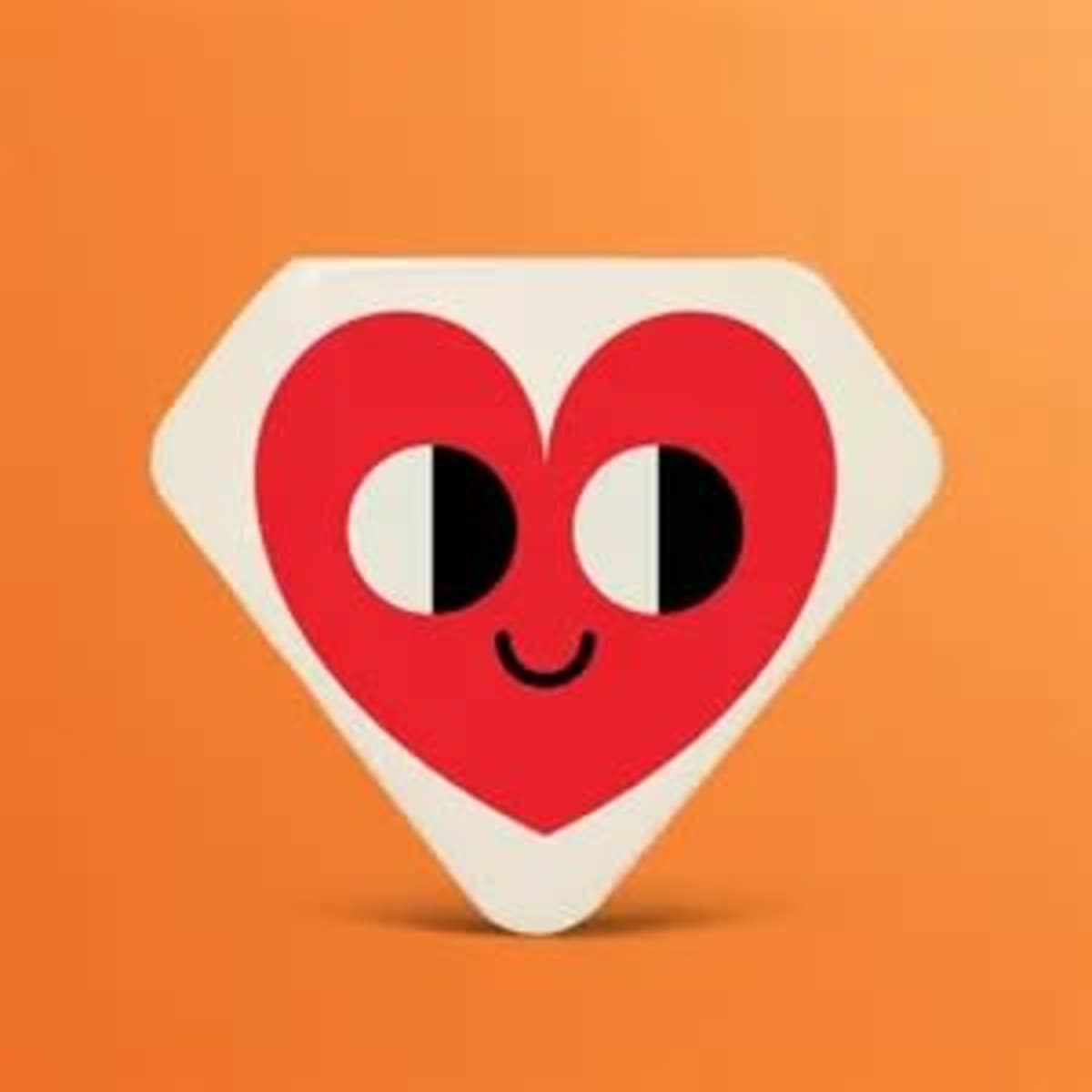 A red and white diamond-shaped button featuring a smiling heart design on an orange background.
