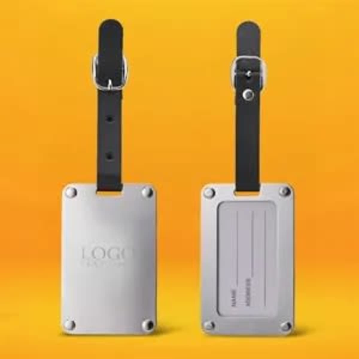 A stainless steel luggage tag with a black leather strap, featuring a logo and a space for personal information.
