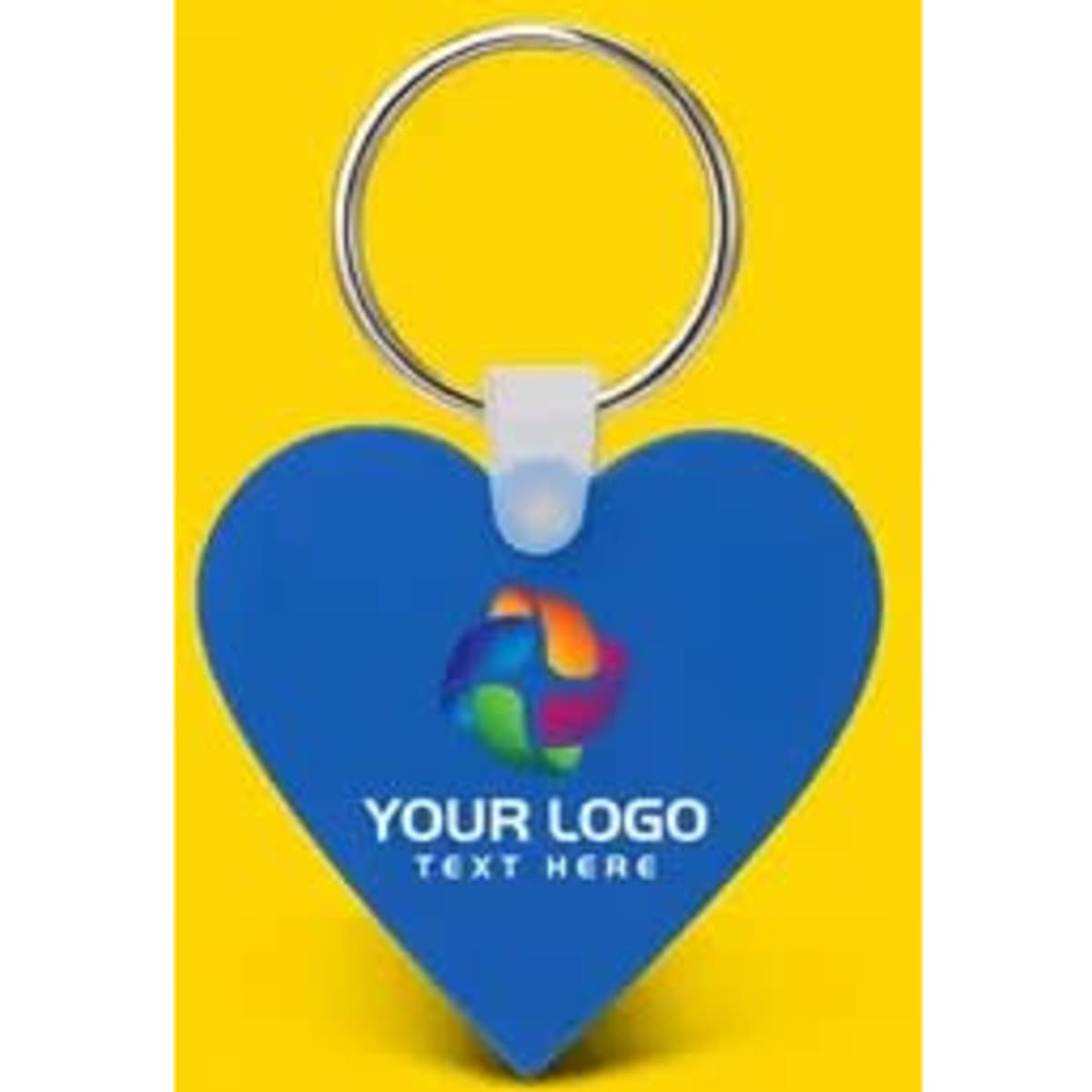 A blue heart-shaped silicone key tag with a metal ring and a branding logo. The background is yellow.